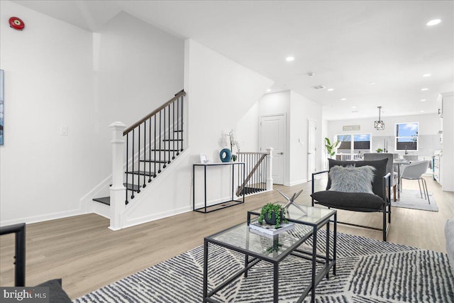 living room with light hardwood / wood-style flooring