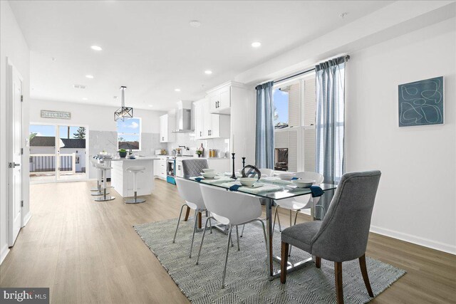 dining space featuring light wood-type flooring