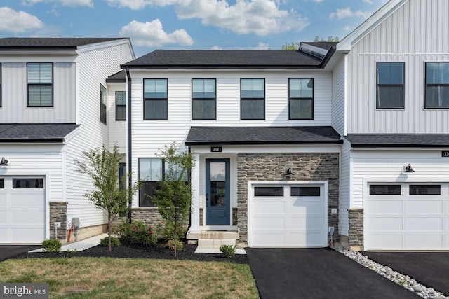 townhome / multi-family property featuring a garage