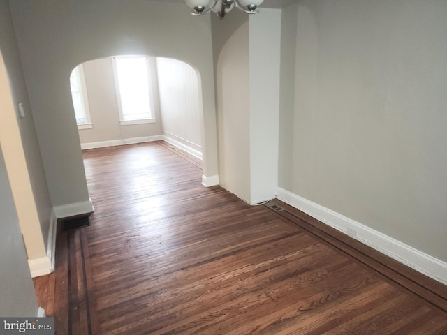 interior space with dark hardwood / wood-style floors