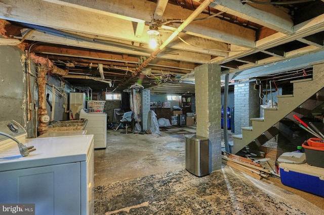 basement with washing machine and clothes dryer