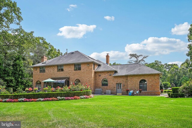 rear view of house with a patio