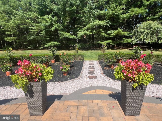 view of patio / terrace featuring central AC, a grill, and outdoor lounge area