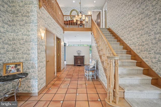 interior space with a towering ceiling and a chandelier