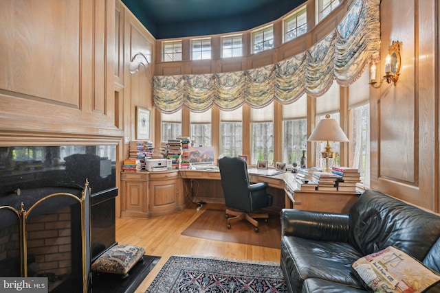 office area featuring built in desk and light hardwood / wood-style floors