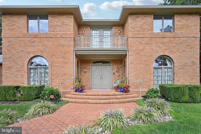 rear view of property with a yard