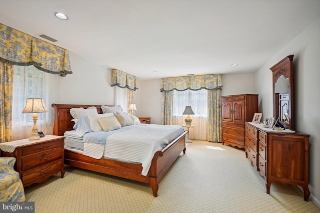 bedroom featuring light carpet