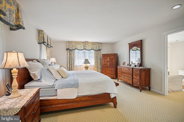 carpeted bedroom with multiple windows