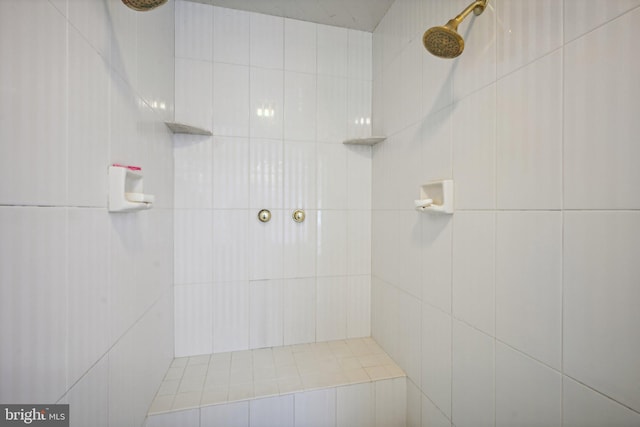 bathroom with tiled shower