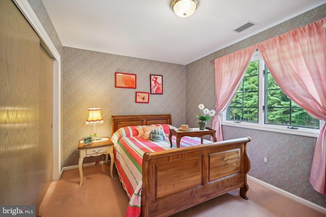 bedroom with a closet and carpet flooring