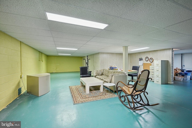 basement with a paneled ceiling