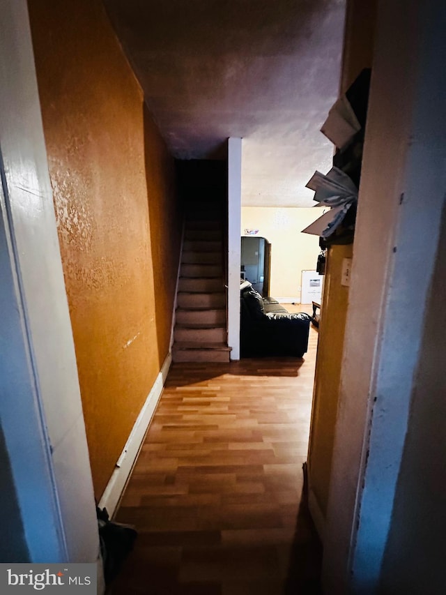 hallway with wood-type flooring