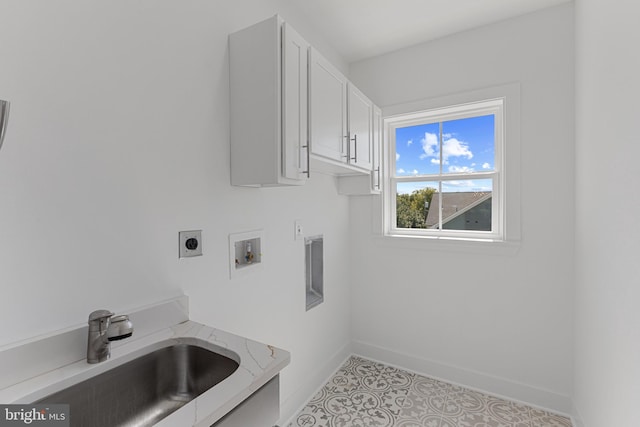 laundry area featuring cabinets, electric dryer hookup, washer hookup, and sink