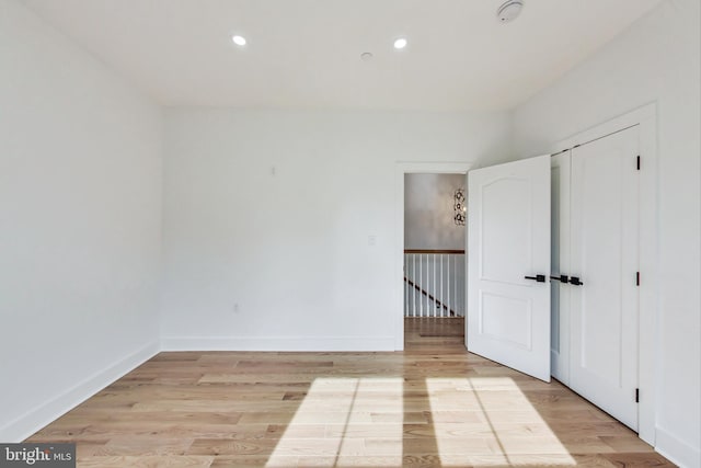 empty room with light hardwood / wood-style floors