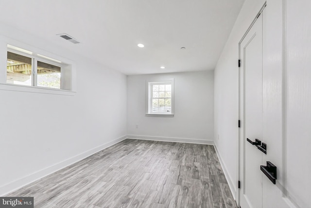 unfurnished room featuring light hardwood / wood-style floors