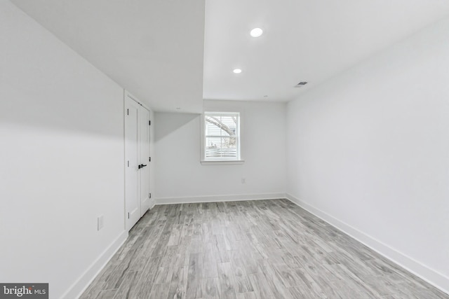 unfurnished room featuring light wood-type flooring