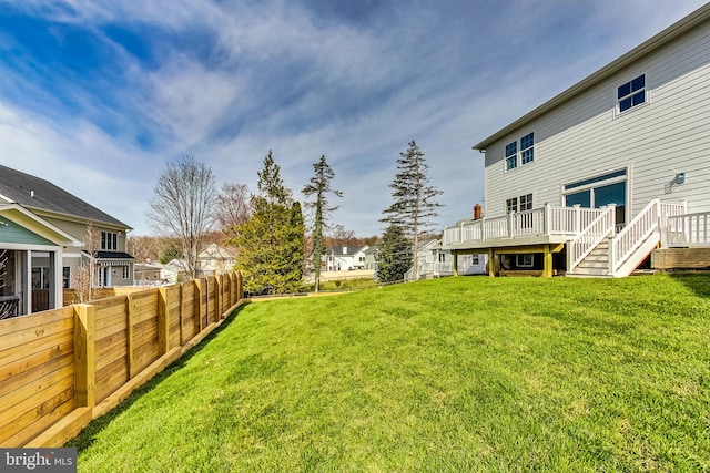 view of yard with a wooden deck