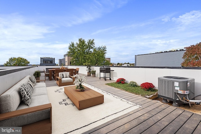 wooden terrace featuring central AC and outdoor lounge area