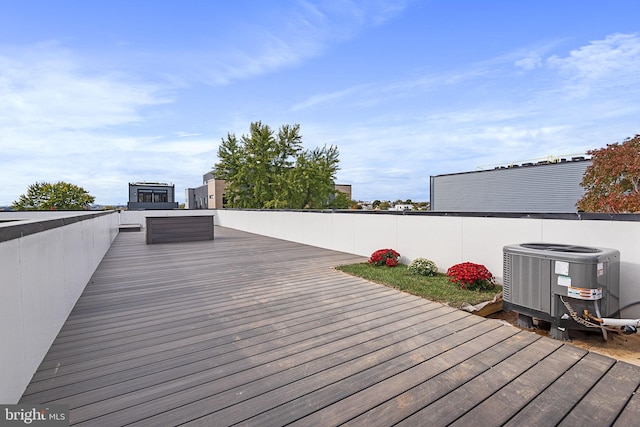 wooden deck featuring central air condition unit