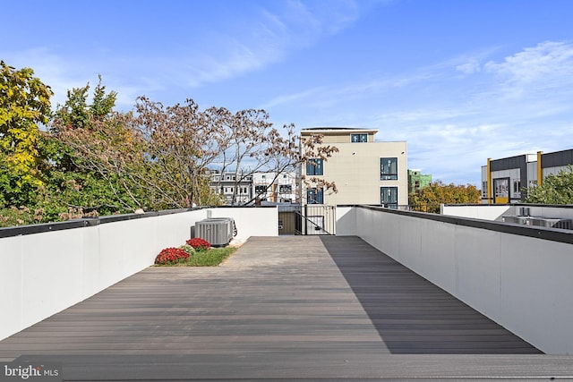 wooden deck with central AC unit