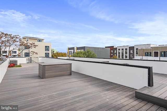 wooden terrace featuring central AC unit