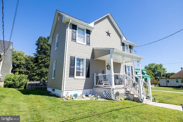 view of front of home with a front yard and a porch