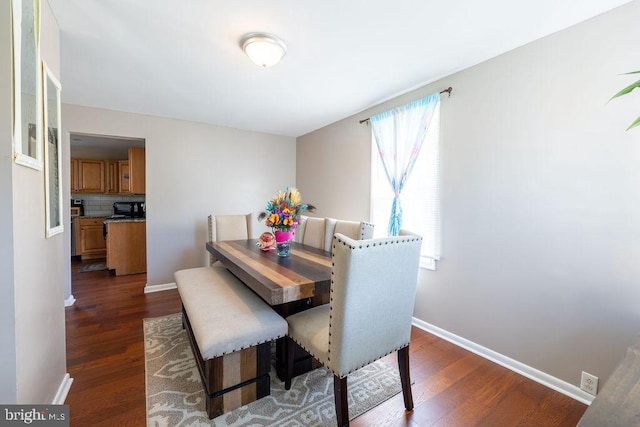 dining room featuring dark hardwood / wood-style flooring