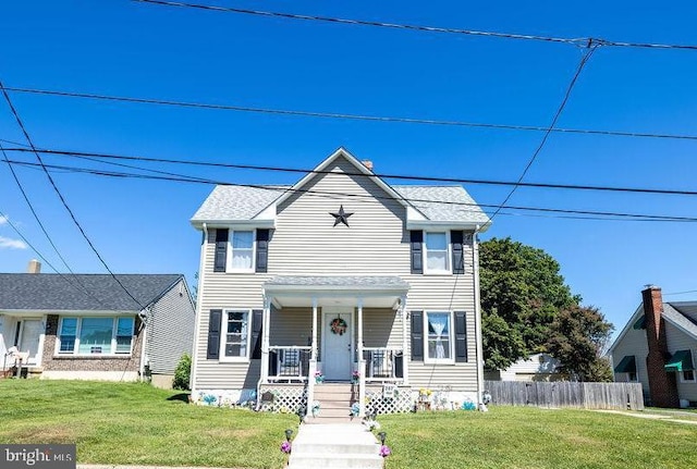 view of front facade featuring a front yard and a porch