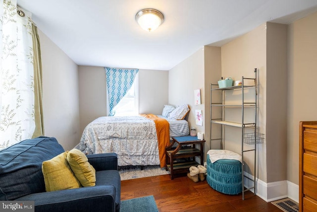 bedroom featuring dark wood-type flooring