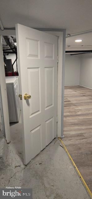 interior space featuring washer / dryer and hardwood / wood-style flooring