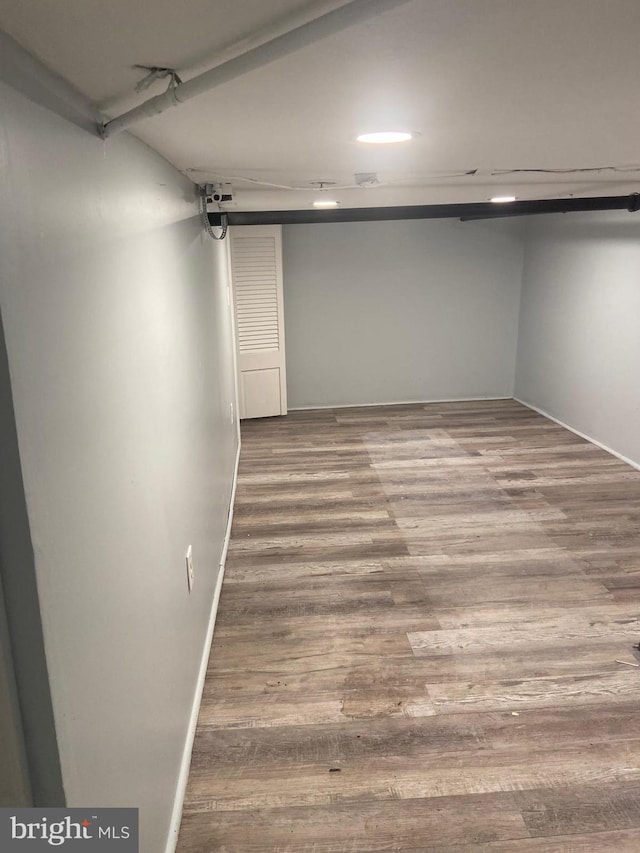 basement featuring hardwood / wood-style floors