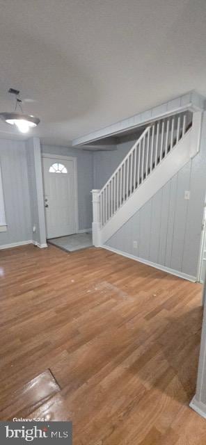 entrance foyer with hardwood / wood-style floors