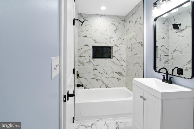 bathroom featuring vanity and tiled shower / bath combo