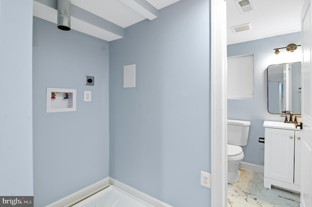 bathroom with vanity and toilet