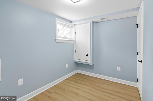 unfurnished room featuring light hardwood / wood-style floors