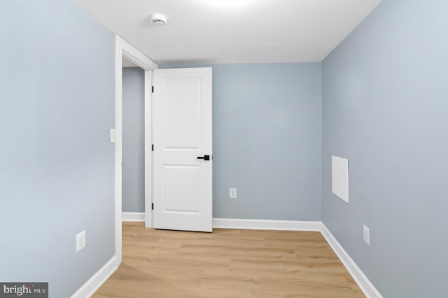 empty room with light hardwood / wood-style floors