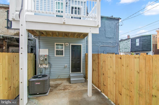 exterior space featuring central AC unit and a balcony