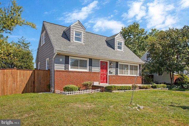 cape cod house featuring a front lawn