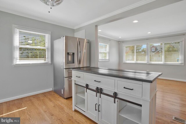 kitchen featuring stainless steel fridge with ice dispenser, crown molding, white cabinets, and light hardwood / wood-style floors