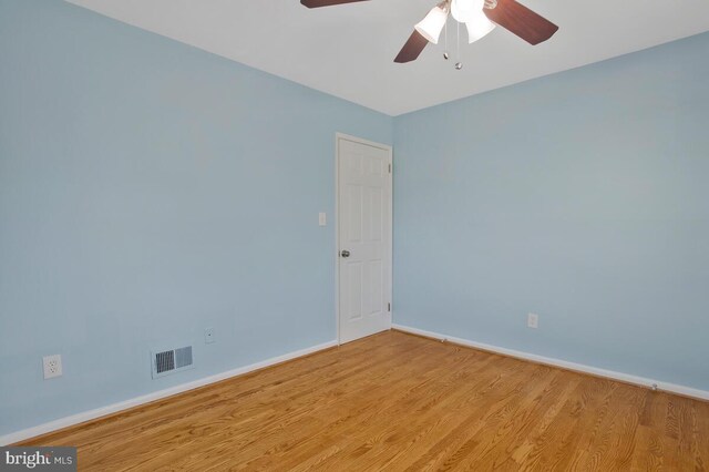 spare room featuring ceiling fan and light hardwood / wood-style flooring