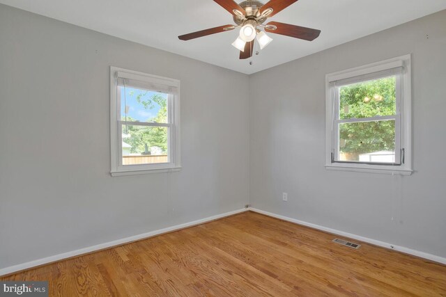 spare room with ceiling fan and light hardwood / wood-style floors