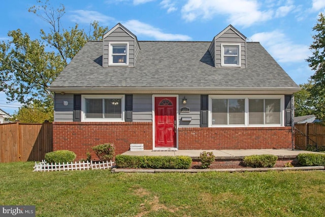 new england style home with a front lawn