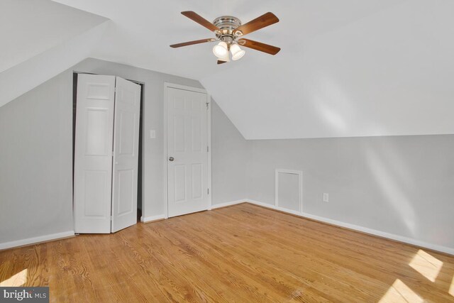 bonus room with light hardwood / wood-style flooring, ceiling fan, and vaulted ceiling