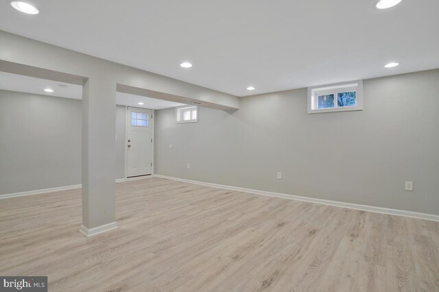 basement featuring light hardwood / wood-style floors