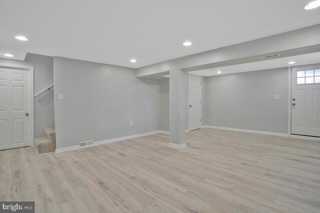 basement featuring light wood-type flooring