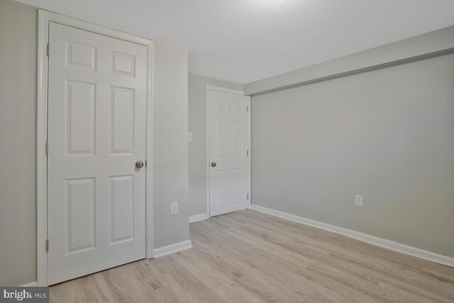 unfurnished bedroom featuring light wood-type flooring