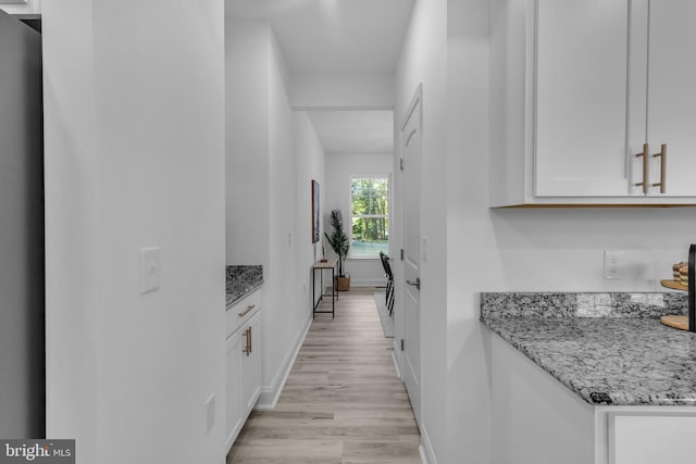 hallway featuring light wood-type flooring