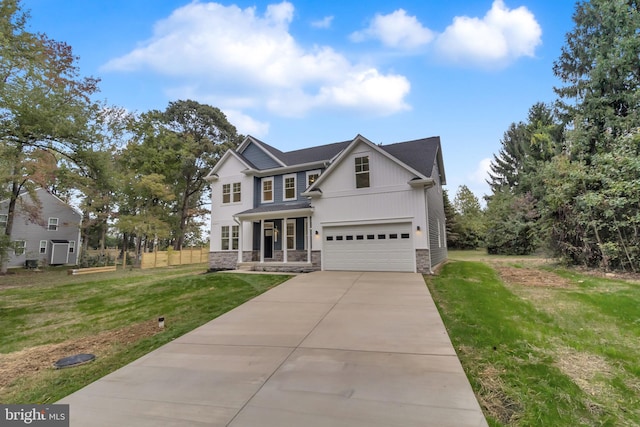 view of front of home featuring a front yard and a garage