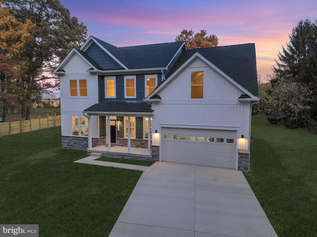 view of front facade featuring a yard and a garage