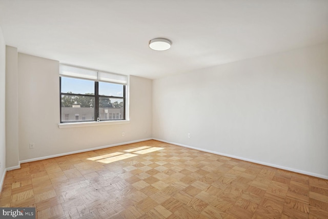 spare room featuring light parquet flooring